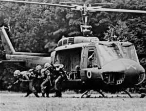 Soldiers deploying from a war helicopter