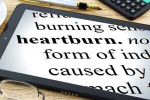 Tablet with heartburn in black text