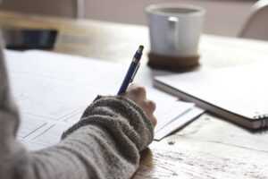 person filling out letter of intent to file