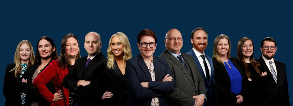 group of veterans attorneys at berry law standing together against a blue background